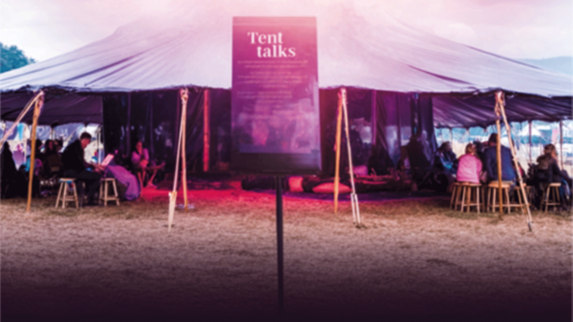 Tent talks venue with people gathering for discussions and workshops